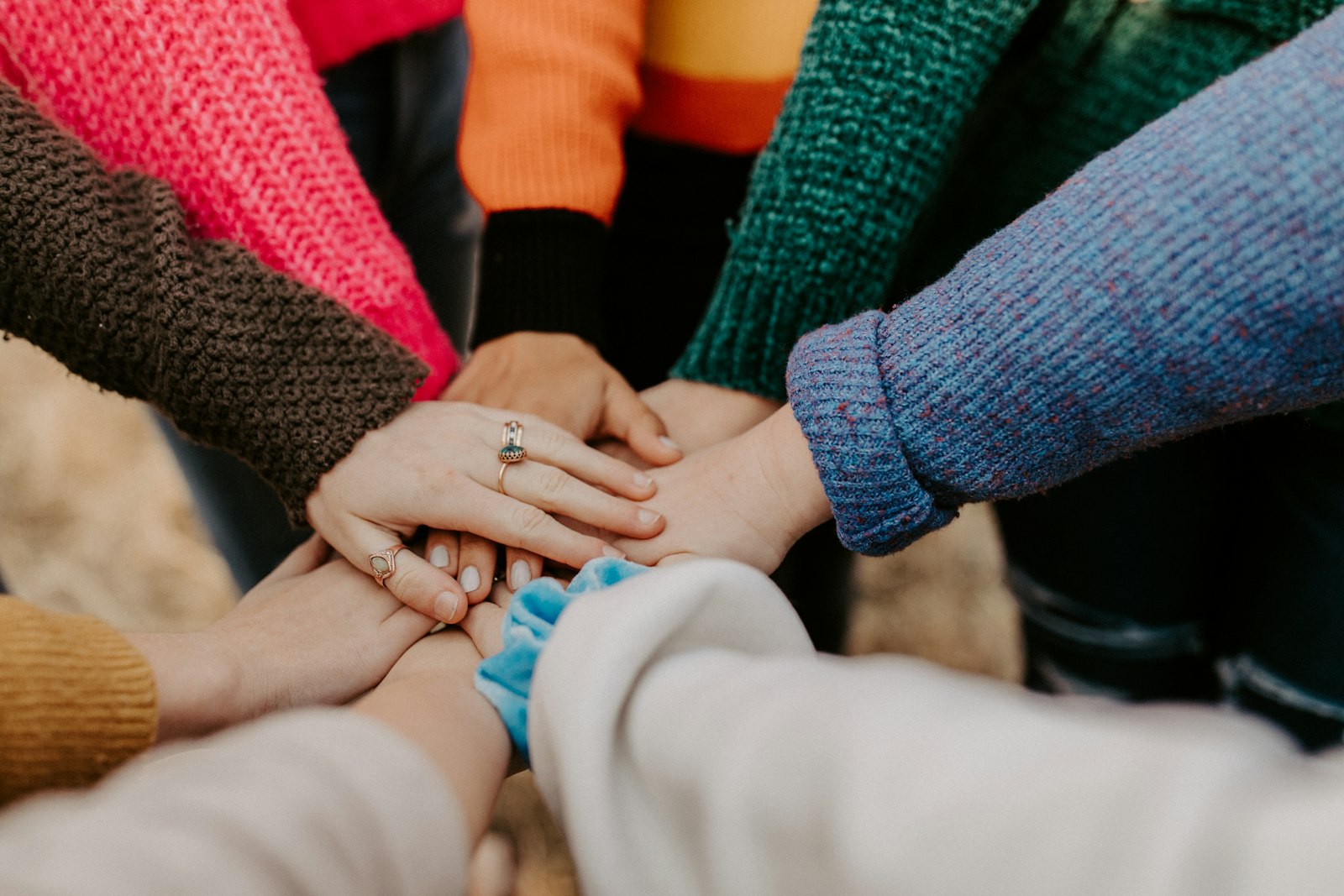 Hands joined together in a circle.