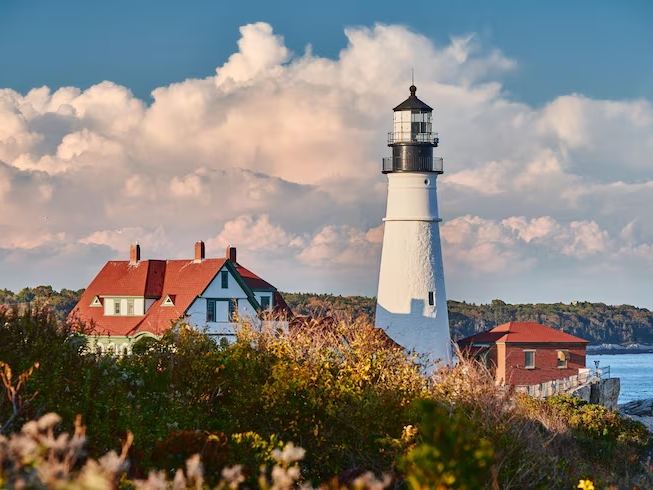 White lighthouse on a rocky coastline